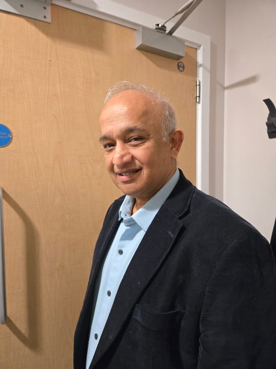 Dr. Harshawardhan Godbole in a dark blazer