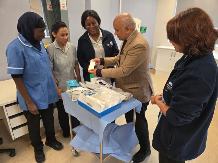 Dr. Harshawardhan Godbole demonstrating equipment to nursing colleagues